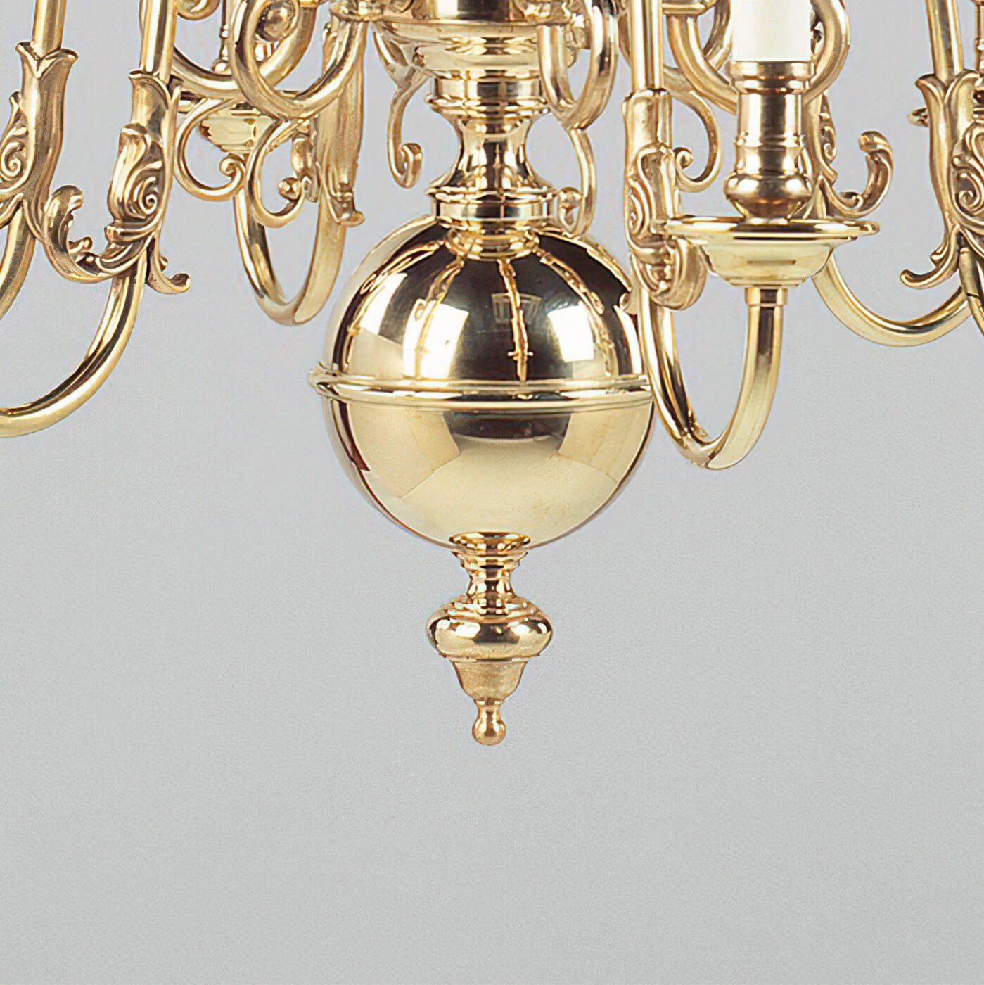 Bottom detail of brass chandelier globe ornament