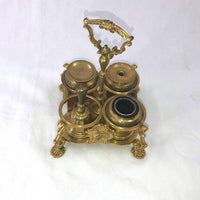 Top view of brass Standish showing ink and pen holders.