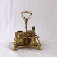 Side view of brass Standish with lid and handle.