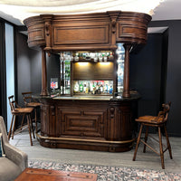 Early English antique bar setup with stools