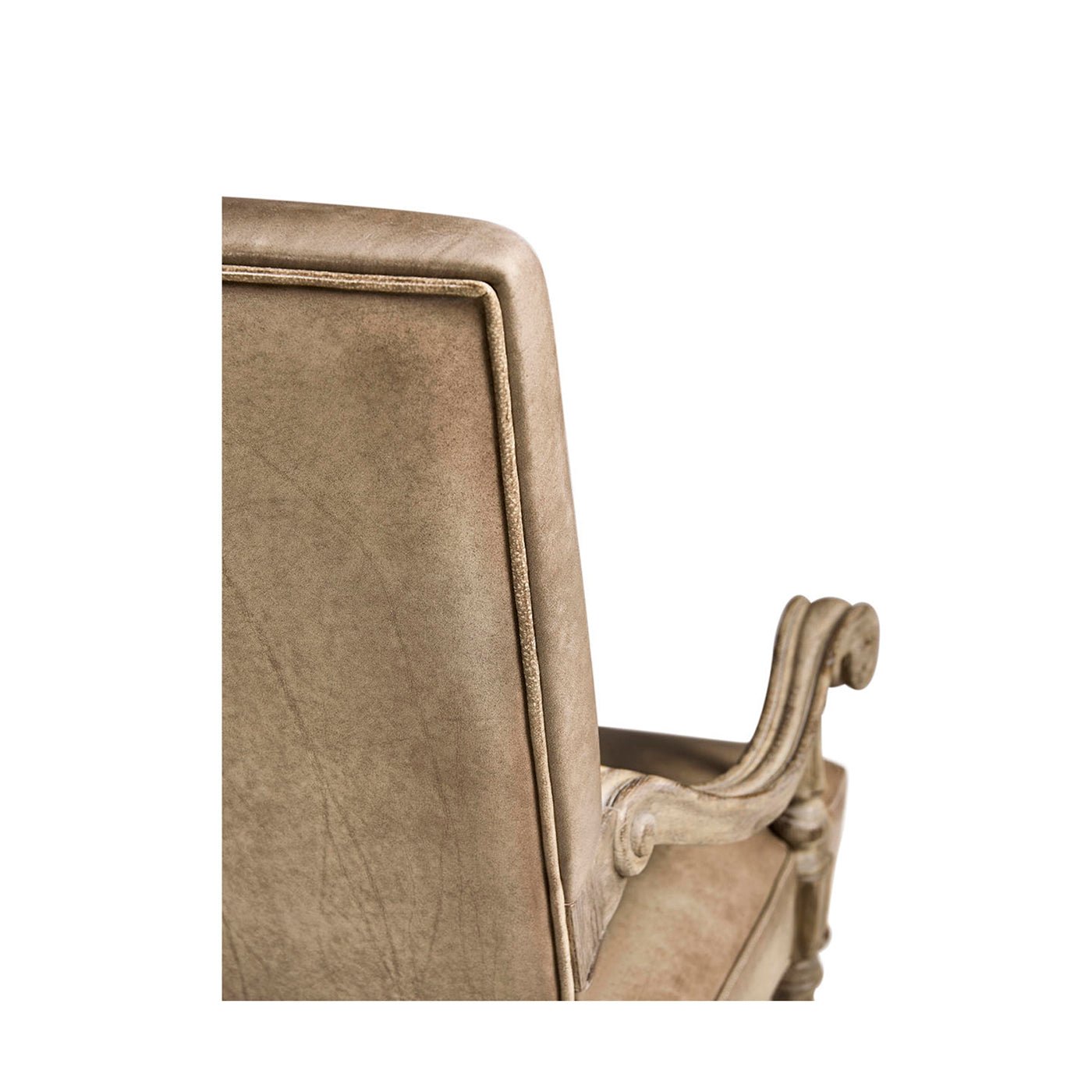 Backrest detail of Early English leather armchair.