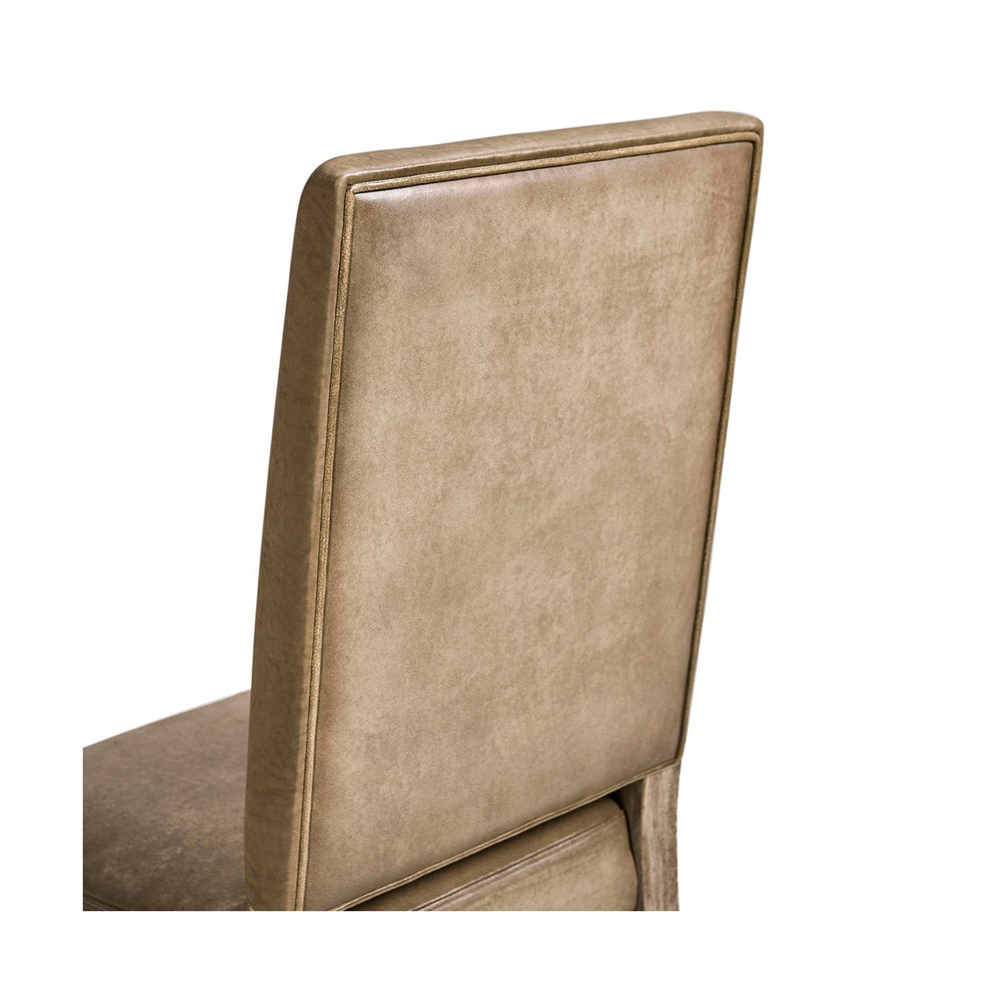 Early English leather chair, backrest detailing.