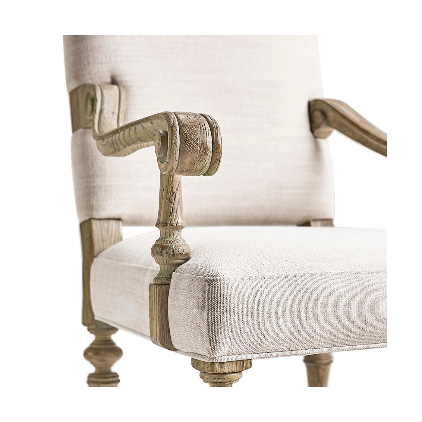 Close-up of armchair detailing, armrest and cushion fabric.
