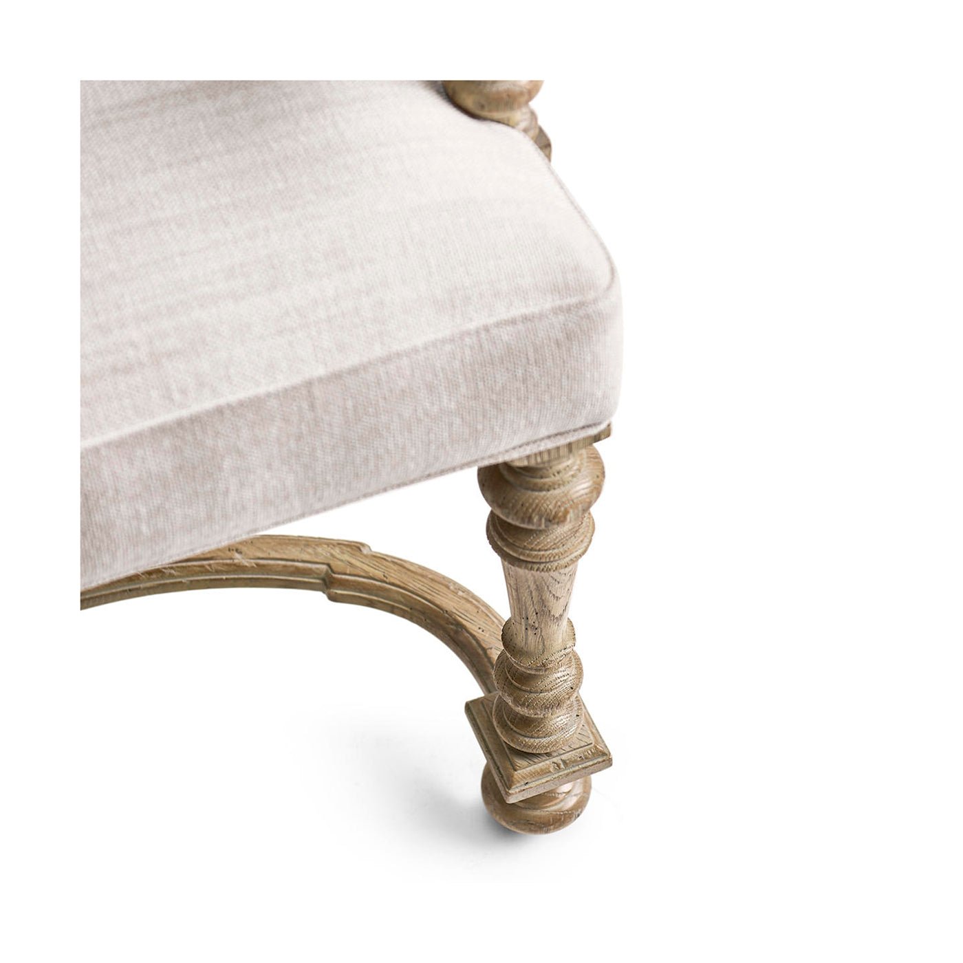 Detailed shot of chair leg, decorative woodwork.
