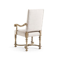 Back view of armchair, detailing on the wooden frame.