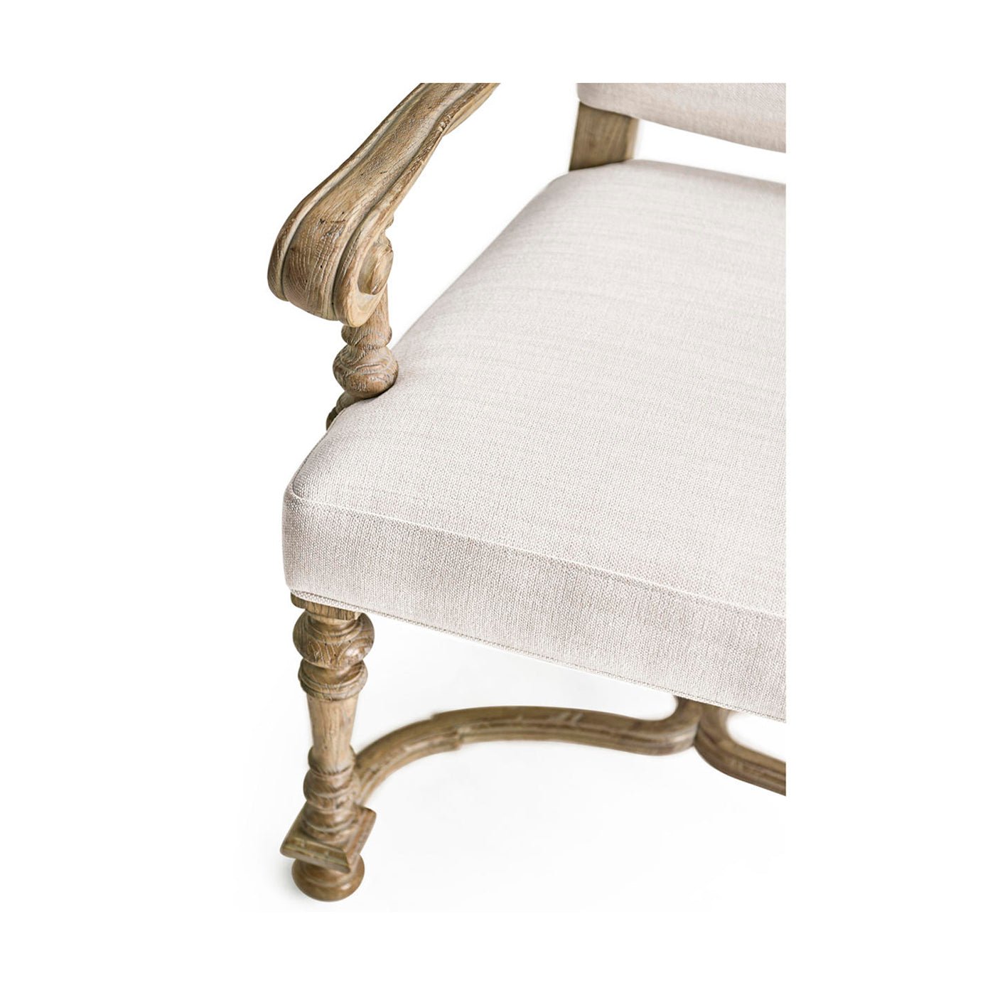 Armchair corner view showing intricate wood leg design.