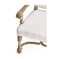 Armchair corner view showing intricate wood leg design.