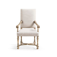 Front view of the upholstered armchair with ornate legs.