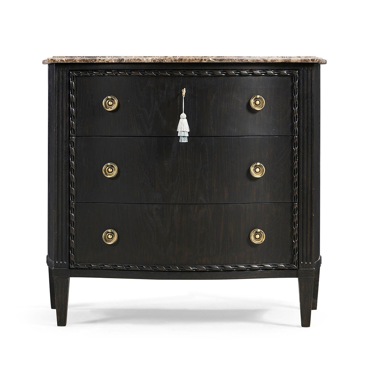 Front view of ebonized marble top chest of drawers.