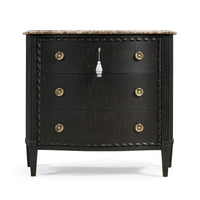 Front view of ebonized marble top chest of drawers.