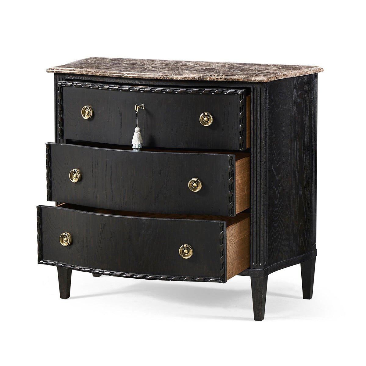 Open drawers of ebonized marble top chest, side view.