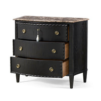 Open drawers of ebonized marble top chest, side view.