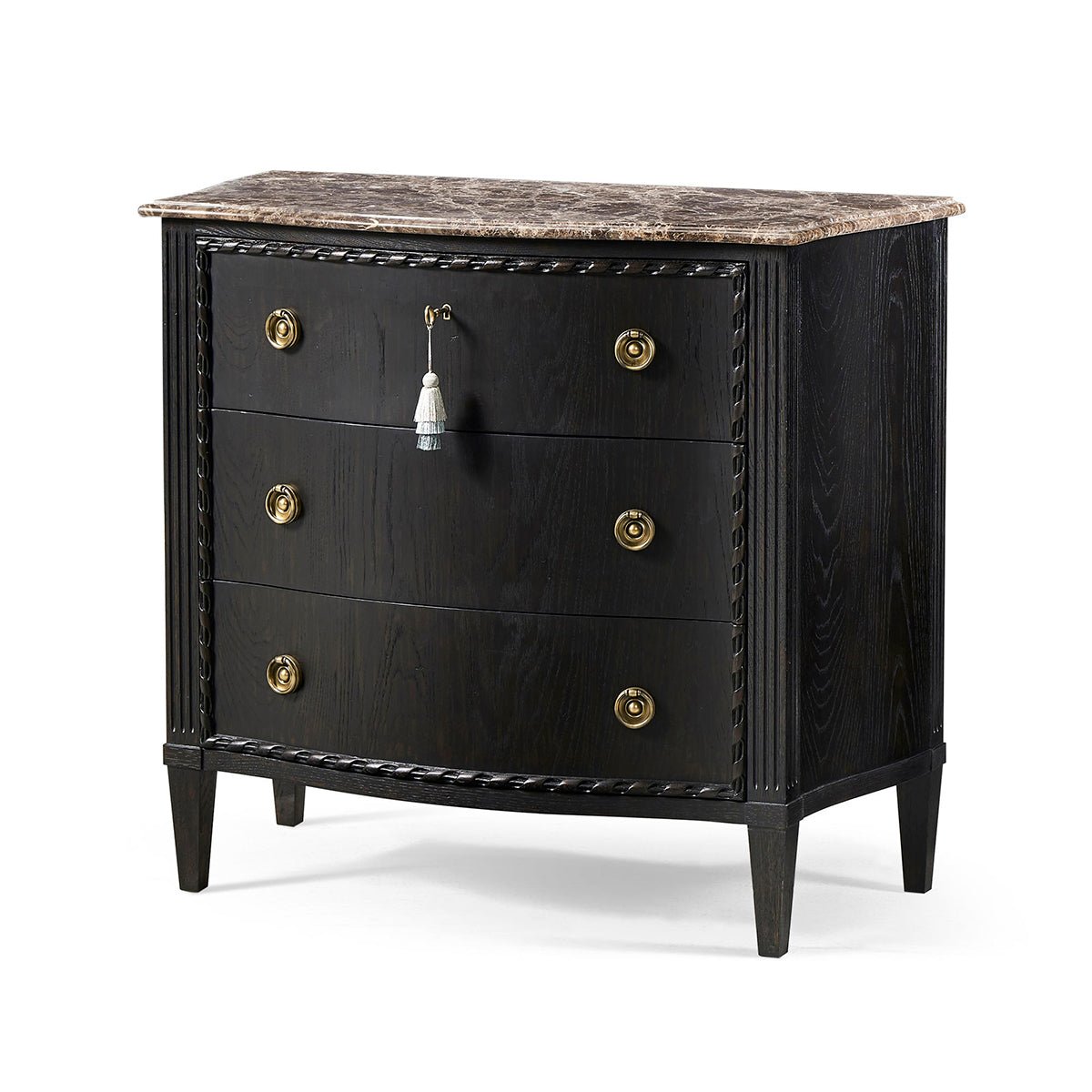 Black marble top chest, angled view, brass handles.