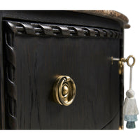 Brass handle detail on ebonized marble top chest.