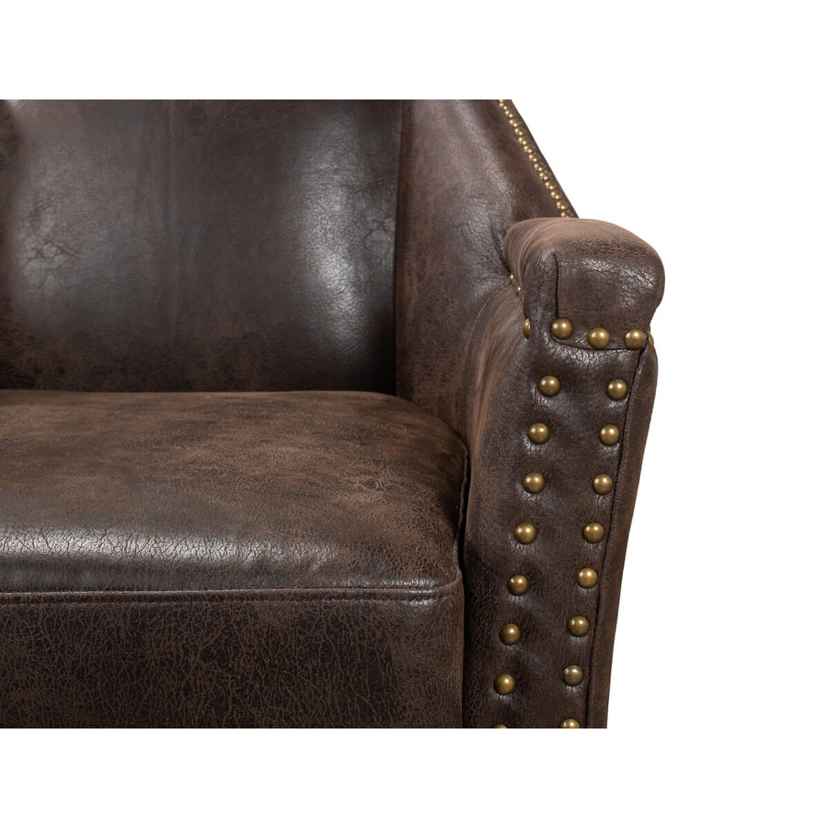 Close-up of armchair armrest with nailhead details.