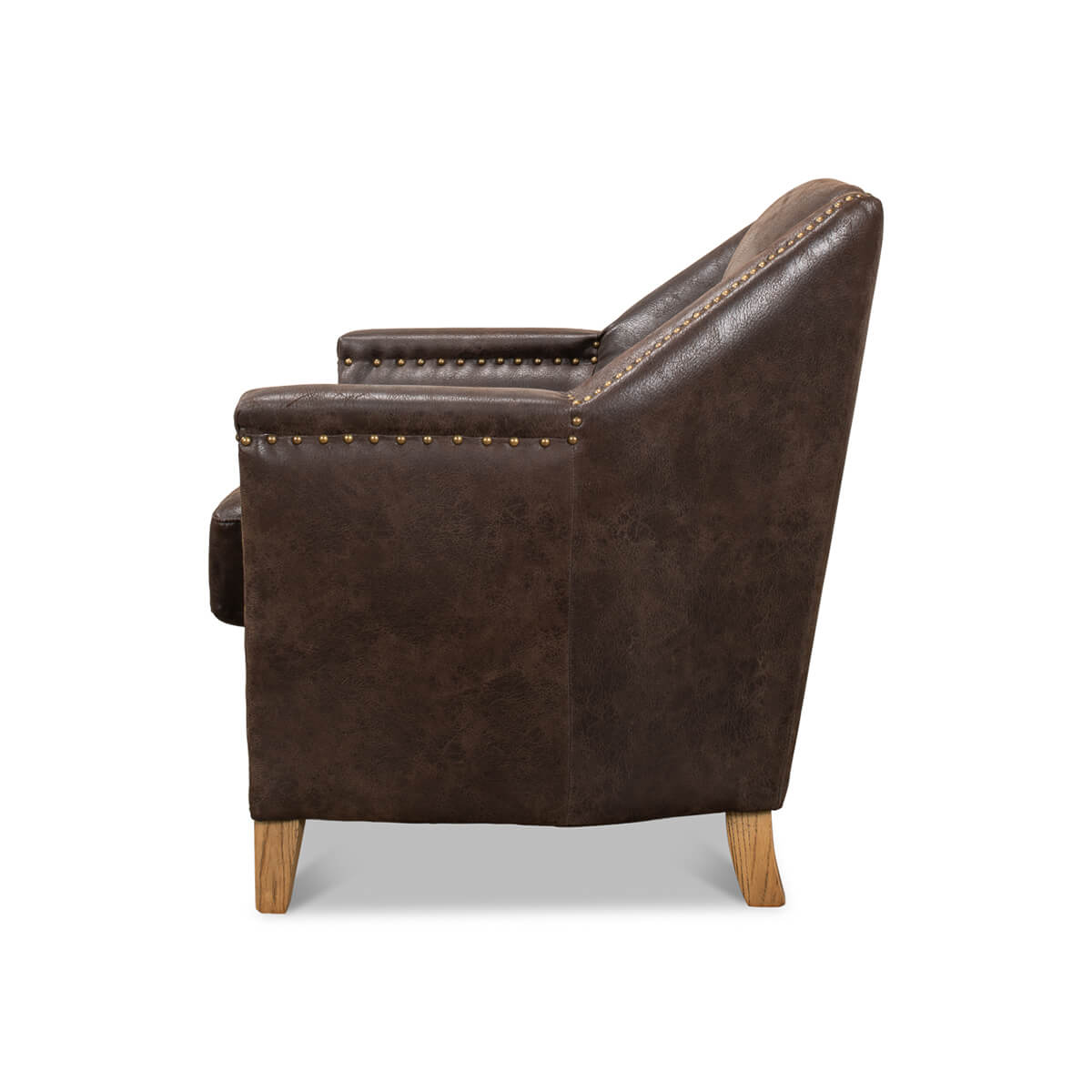 Side profile of brown leather chair, showing armrest.