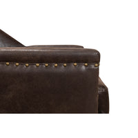 Detailed view of armrest with nailhead accents.