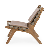 Side view of the tan leather armless chair showing its angled ash frame and woven strap seat