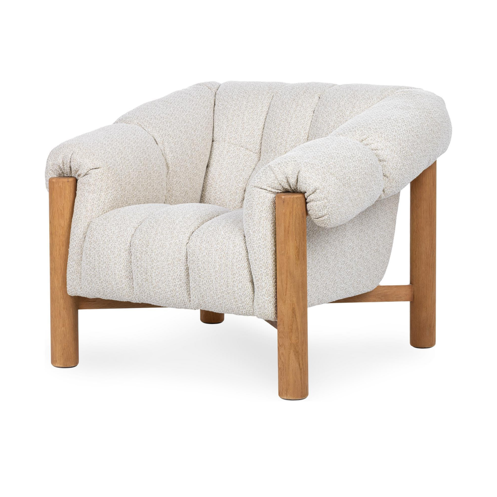 Cream channel-tufted accent chair with rolled arms and an exposed oak frame