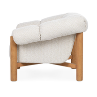 Side view of the Cream chair's rolled arm, upholstered side and oak frame
