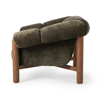 Side view of the Olive Green chair with padded upholstery above an open oak frame