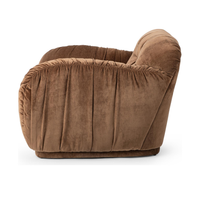 Side view of the Bronze chair showing gathered fabric along its broad arm