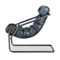 Side view of the Ocean Blue leather chair showing its curved sling and cantilever iron base