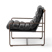 Side view of the Jet Black leather chair showing its channelled sling and open iron frame