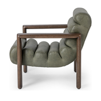 Side view of the Soft Sage leather chair showing its curved channelled seat and open wood frame