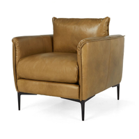 Adobe tan leather club chair with curved arms and slim black legs, three-quarter view