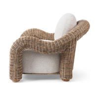 Side view of the Natural rattan chair showing its curved arms and woven legs