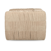 Side view of the French Vanilla chair's gathered upholstery and horizontal seams