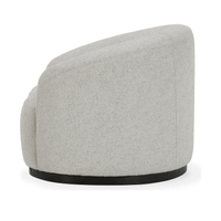 Side view of the Coastal Breeze chair's curved upholstered back and dark swivel base