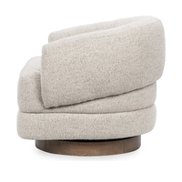 Side view of the Dusty Beige swivel chair with a rolled back and circular wood base