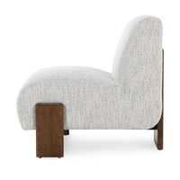 Side view of the Ivory armless chair's sloping back and broad ash supports