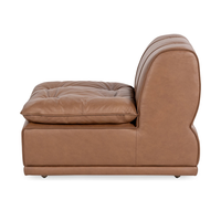Side view of toffee brown leather armless chair with low base and curved back