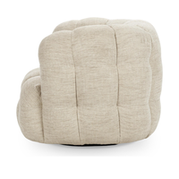 Side view of the beige swivel chair showing tufting around its rounded back