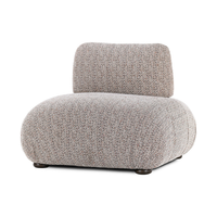 Armless accent chair with red-flecked upholstery, a rounded seat and short dark feet