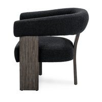 Side view of the Charcoal chair's curved padded back and broad oak-veneered supports