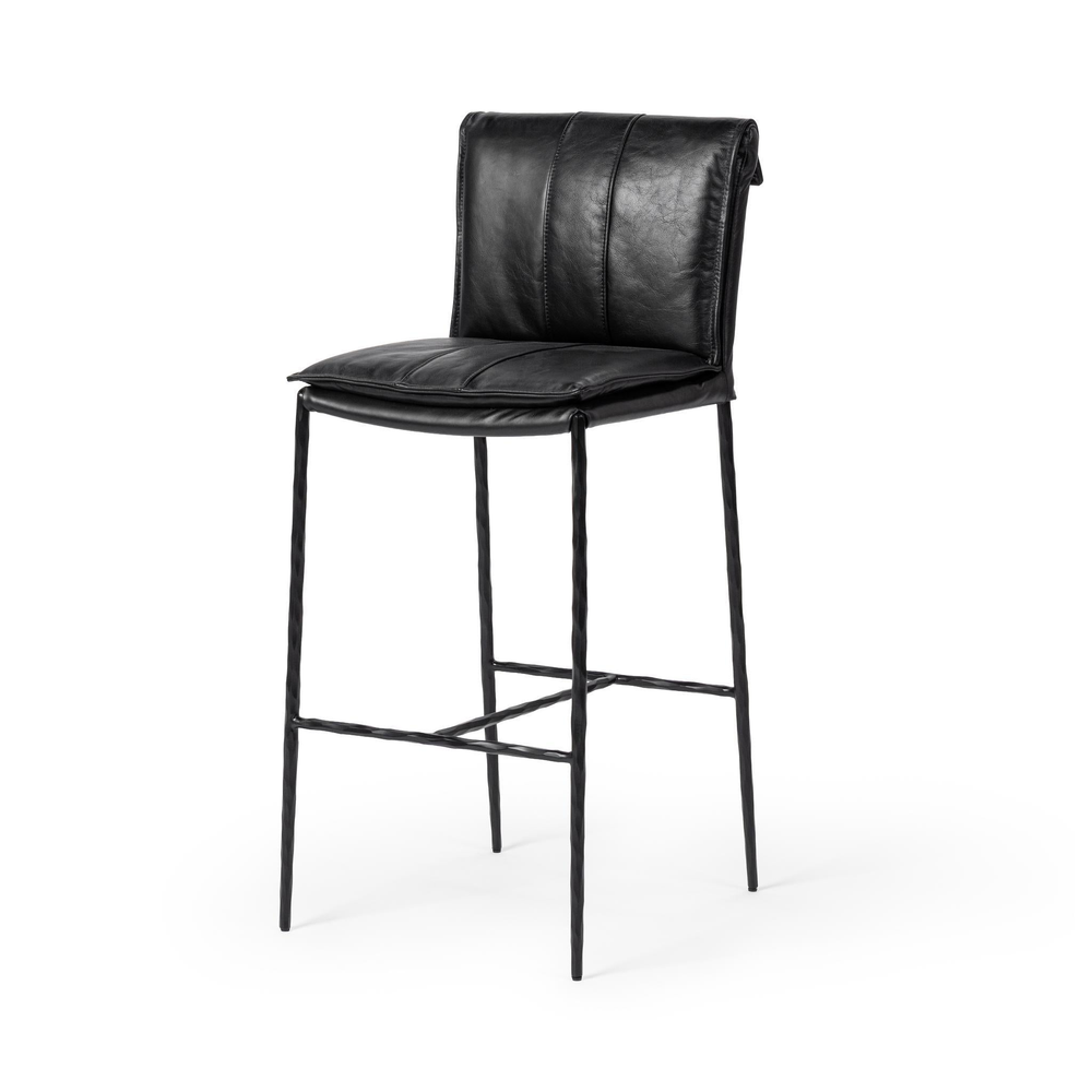 Slim-frame black leather bar stool in a three-quarter front view, showing the stitched seat and slender iron legs
