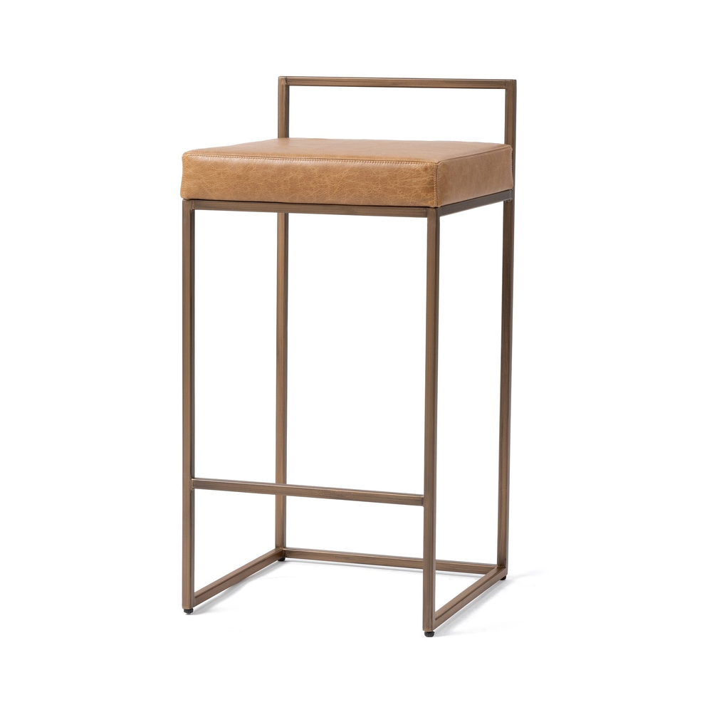 Front three-quarter view of tan low-back leather counter stool with a bronze-toned iron frame.