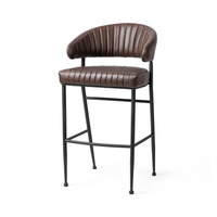 Fluted brown leather bar stool in a three-quarter front view, showing the curved back and black iron frame
