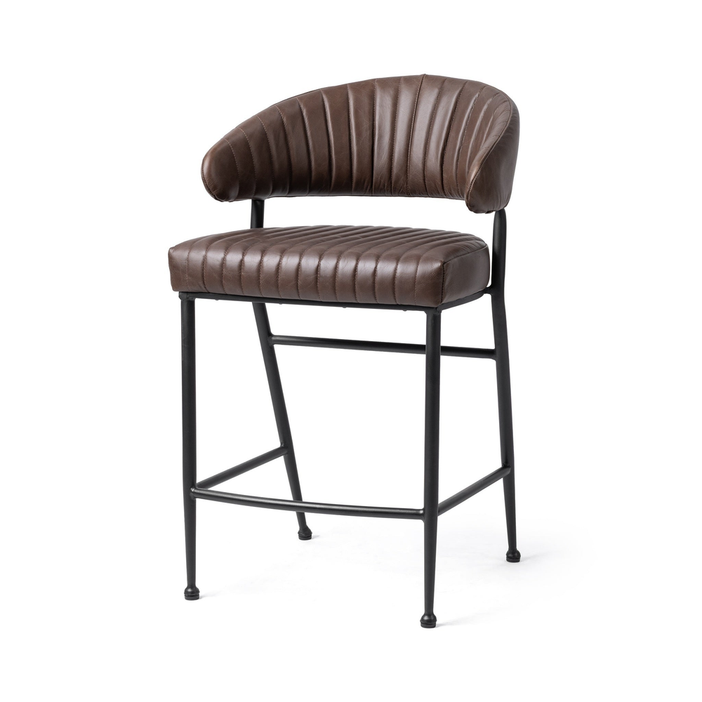 Fluted brown leather counter stool in a three-quarter front view, showing the curved back and black iron frame