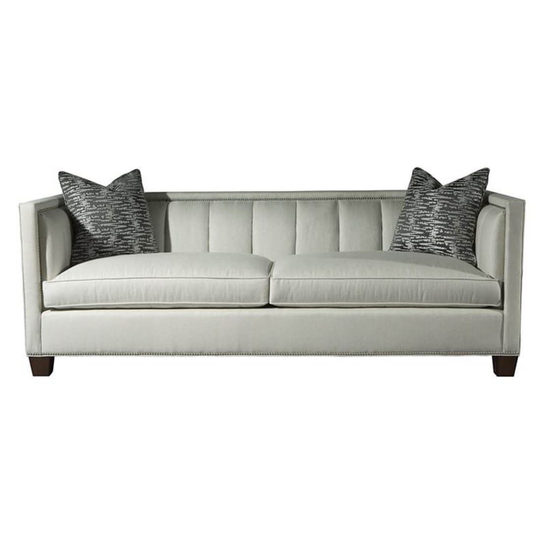 Front view of plush channeled sofa with pillows.