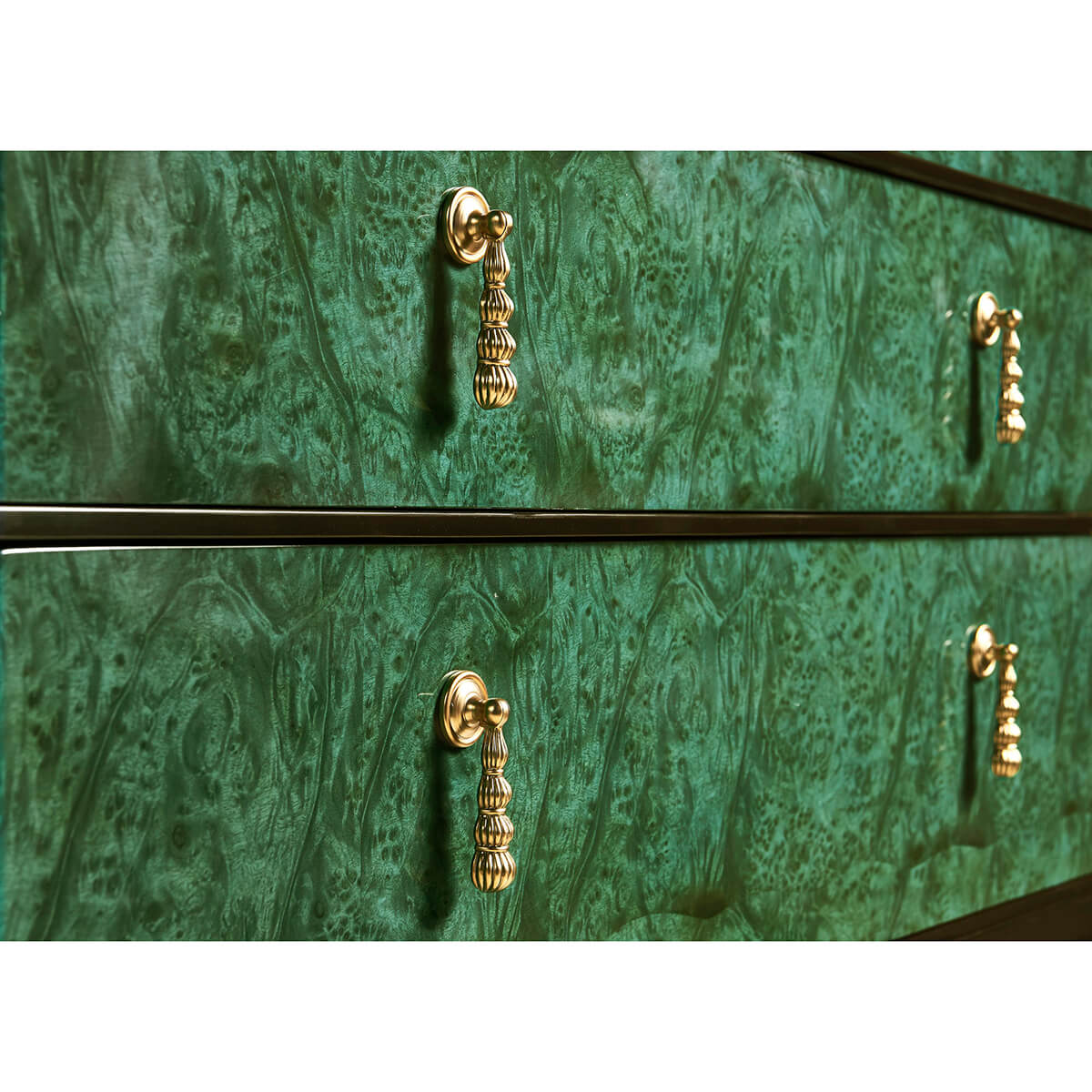 Close-up of emerald dresser handles and texture.