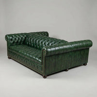 Double-sided Chesterfield sofa, green leather, angled back view.