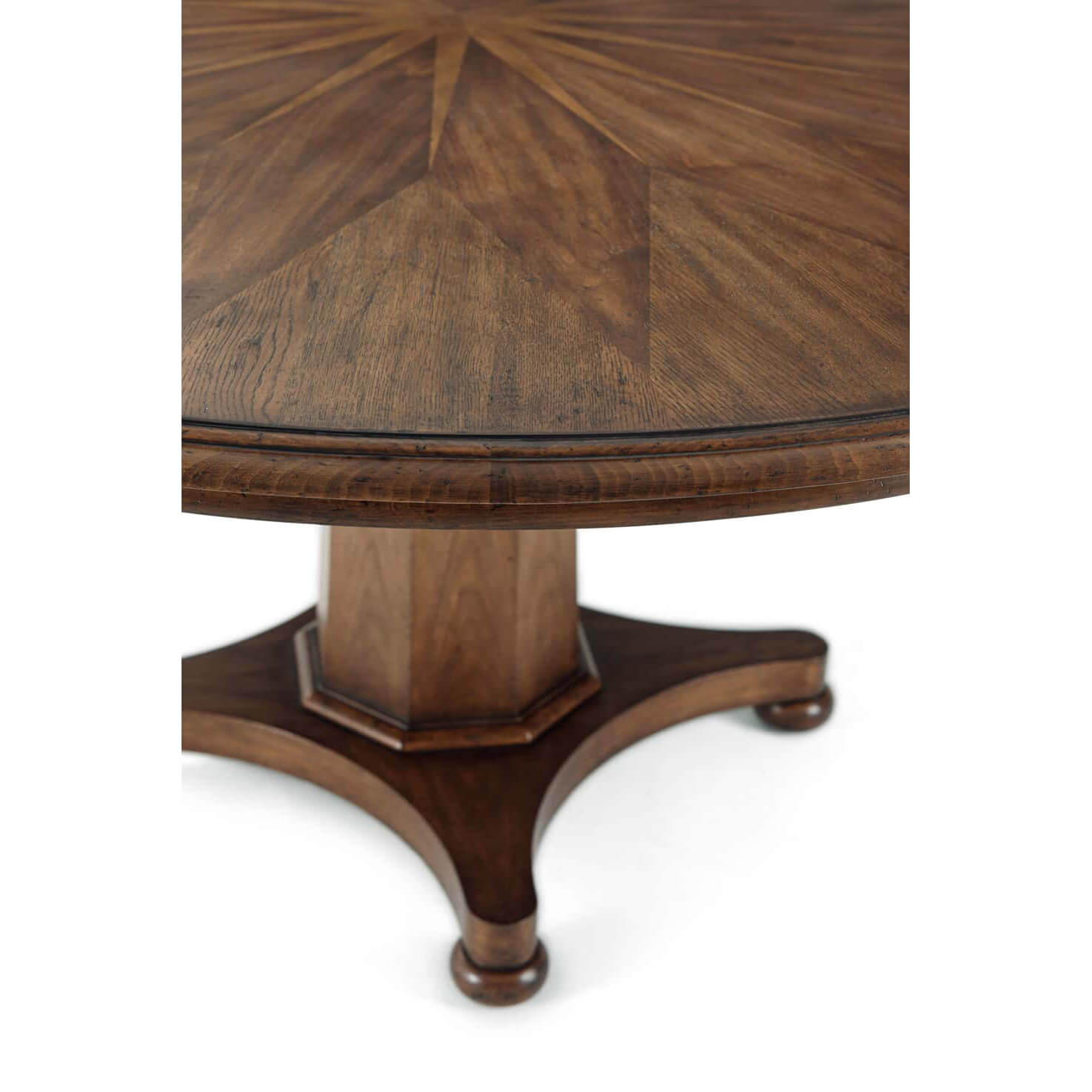 Close-up of pedestal base and table edge detail.