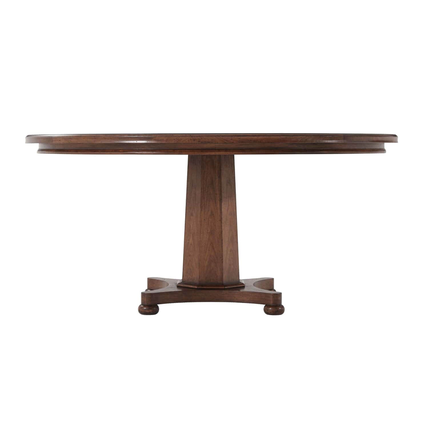 Side view of wooden dining table with pedestal base.