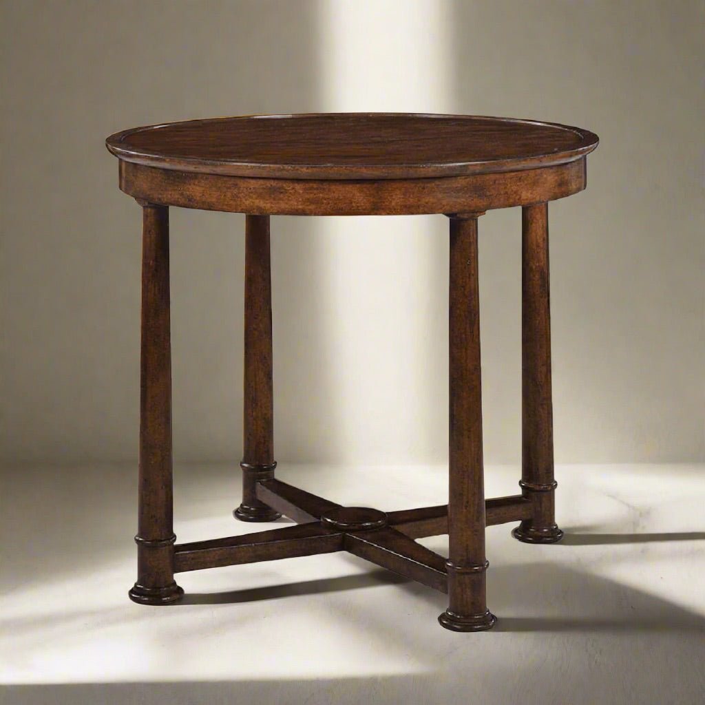 Empire style round side table, spotlighted setting.