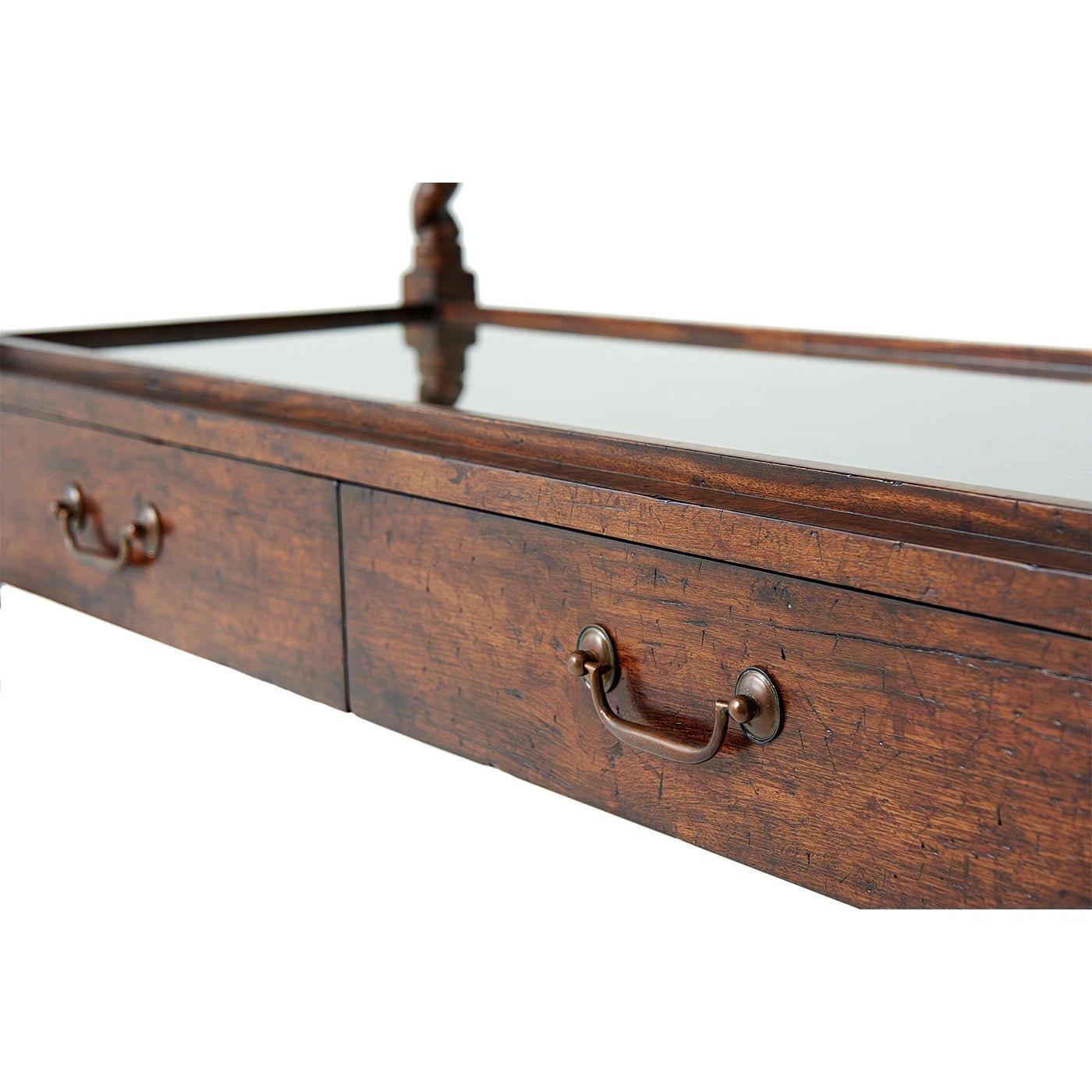 Close-up of antique serving table drawers with handles.